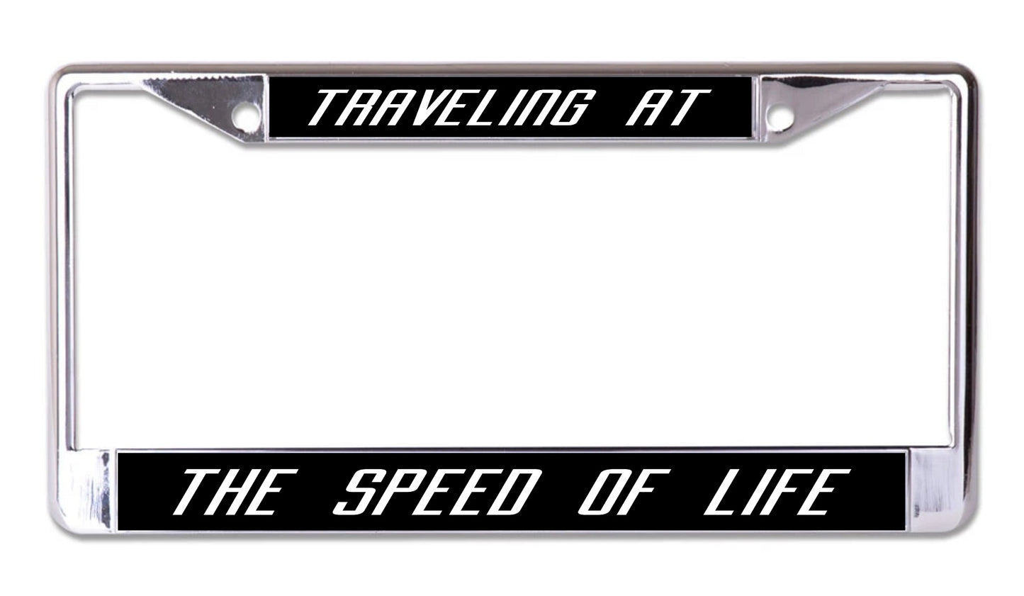 Traveling At The Speed Of Life Chrome License Plate Frame